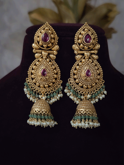 Ruby stone top line of 11cm broad choker set with nrityangna's and elephants and leaf shaped hanging tukdi in center