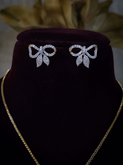 Bow with leaf zircon studded pendant in 7 inch long chain