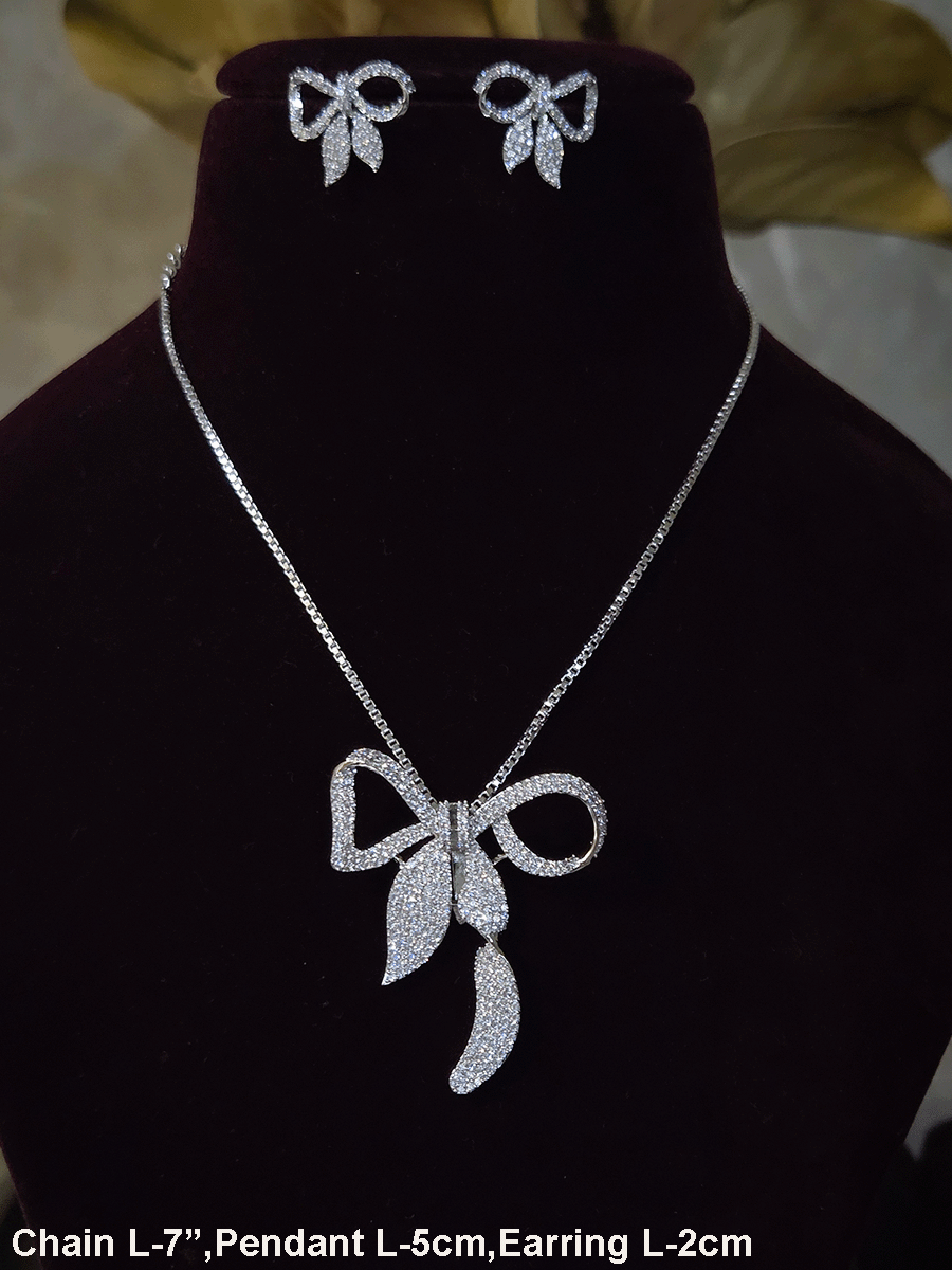 Bow with leaf zircon studded pendant in 7 inch long chain