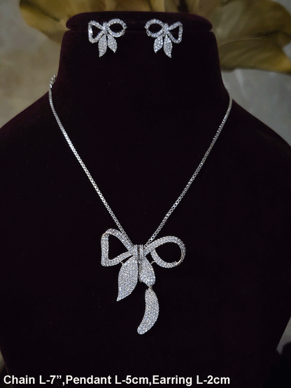 Bow with leaf zircon studded pendant in 7 inch long chain