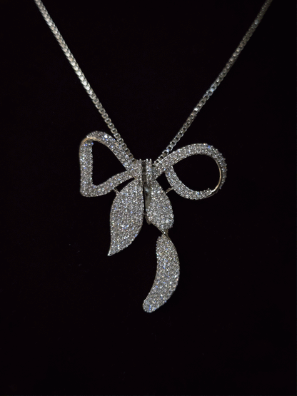 Bow with leaf zircon studded pendant in 7 inch long chain
