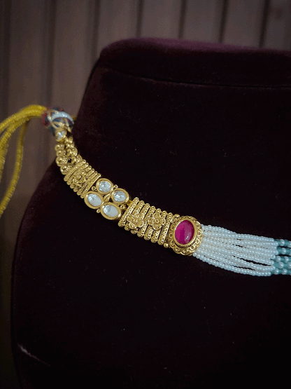 Oval ruby stone kundan flower center side cheed strings set