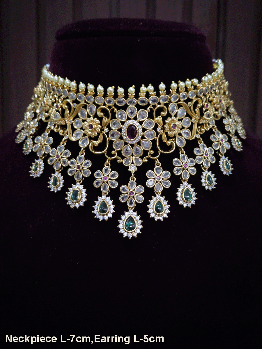 Polki,ruby and green stones studded flower and leaf tukdi tassel drops choker set