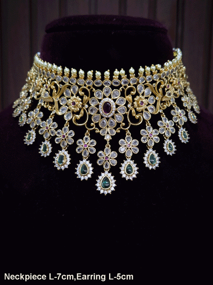 Polki,ruby and green stones studded flower and leaf tukdi tassel drops choker set