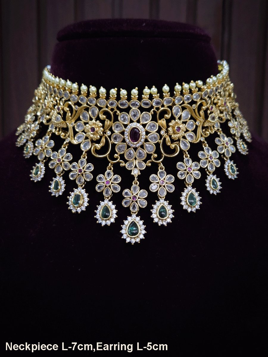 Polki,ruby and green stones studded flower and leaf tukdi tassel drops choker set
