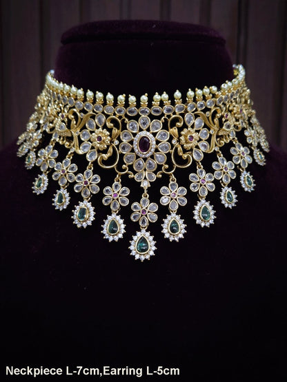 Polki,ruby and green stones studded flower and leaf tukdi tassel drops choker set