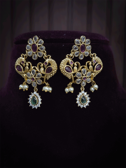Polki,ruby and green stones studded flower and leaf tukdi tassel drops choker set
