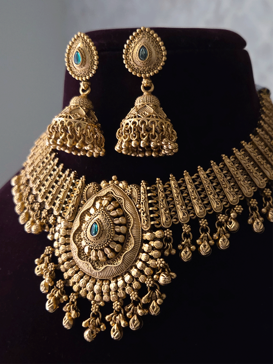 Leaf design center with coloured stone ghunghru hangings set with side broad chain