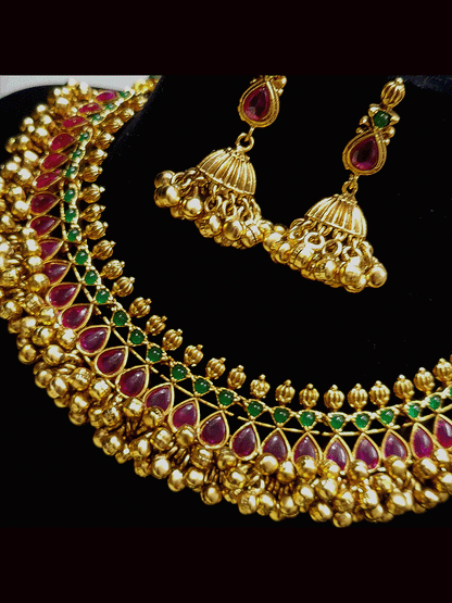 Ruby and green stones studded ghunghru cluster lace classy set in antique gold finish