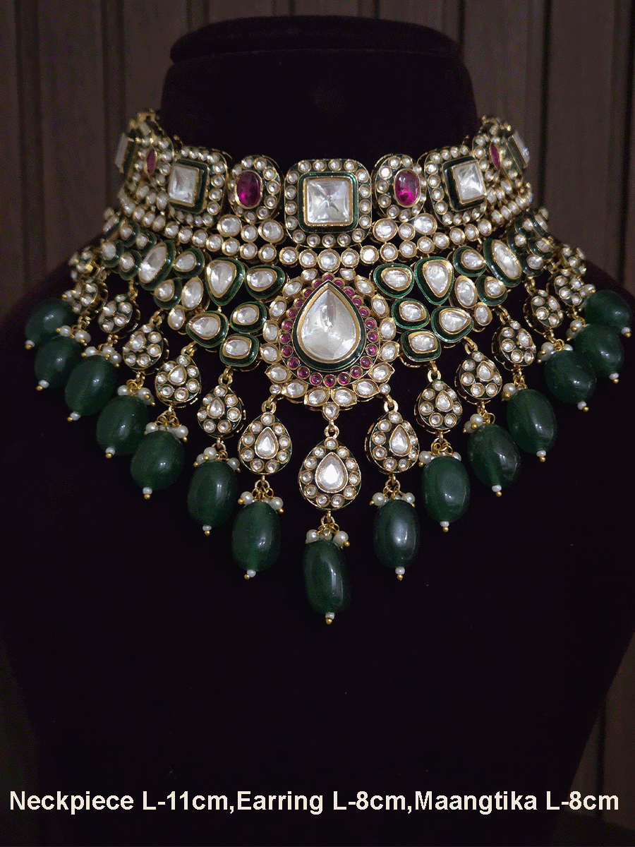 Tear drop and square shaped uncut polki 11cm broad set with green drops and ruby stones detailing
