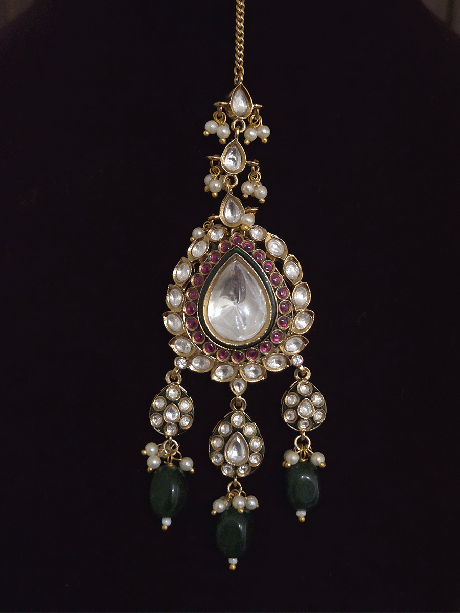 Tear drop and square shaped uncut polki 11cm broad set with green drops and ruby stones detailing