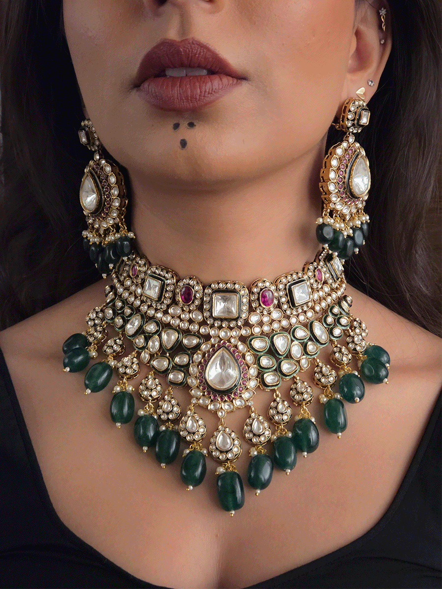 Tear drop and square shaped uncut polki 11cm broad set with green drops and ruby stones detailing