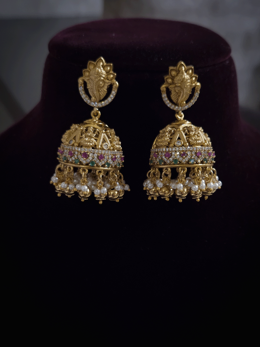 Laxmiji and Ganpatiji motif's zircon studded choker with peacock design