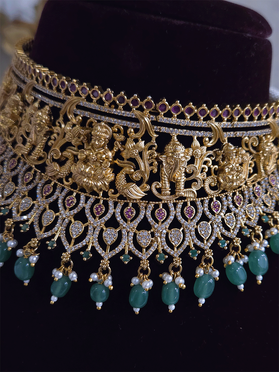 Laxmiji and Ganpatiji motif's zircon studded choker with peacock design