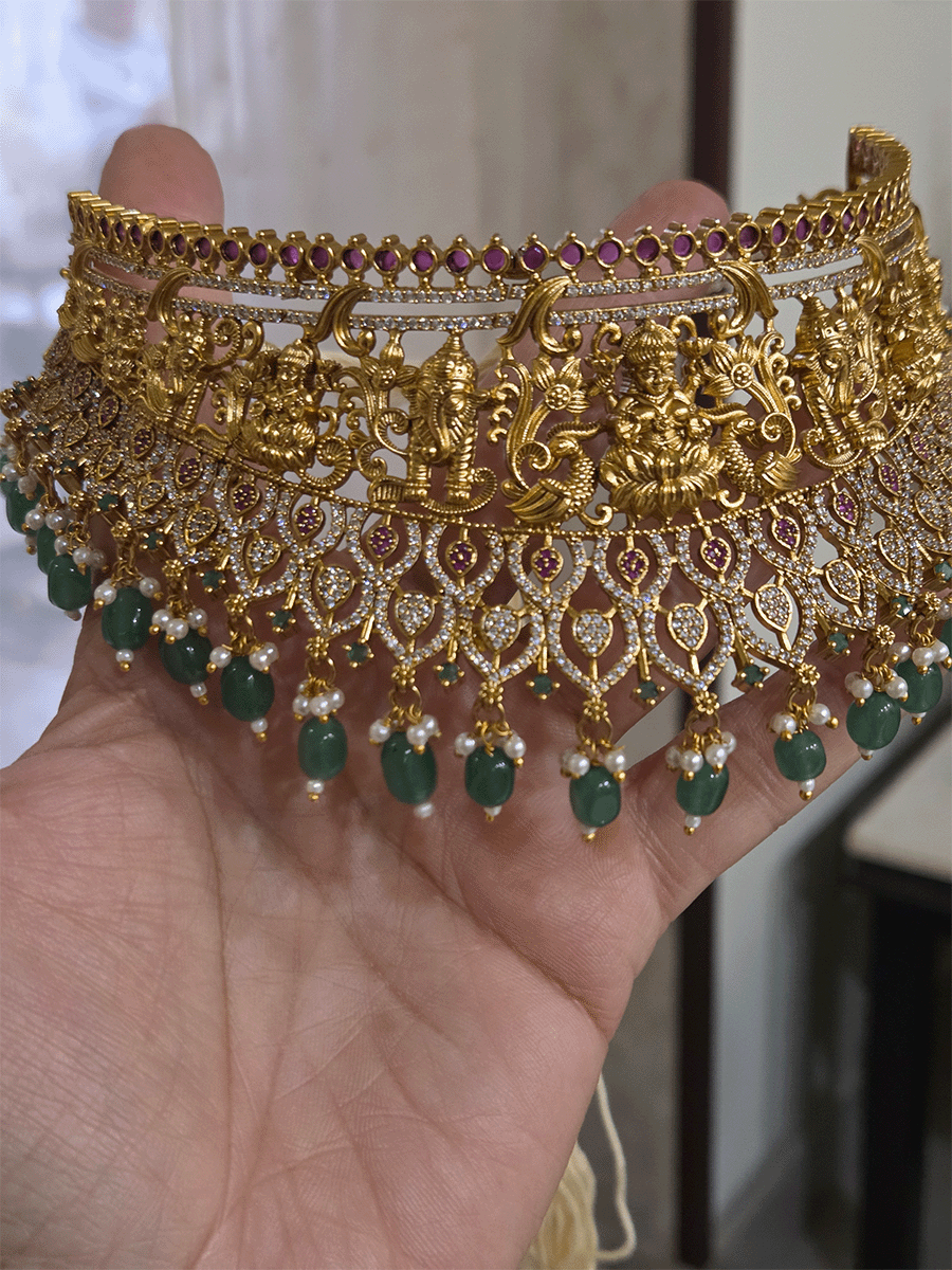Laxmiji and Ganpatiji motif's zircon studded choker with peacock design