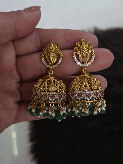 Laxmiji and Ganpatiji motif's zircon studded choker with peacock design