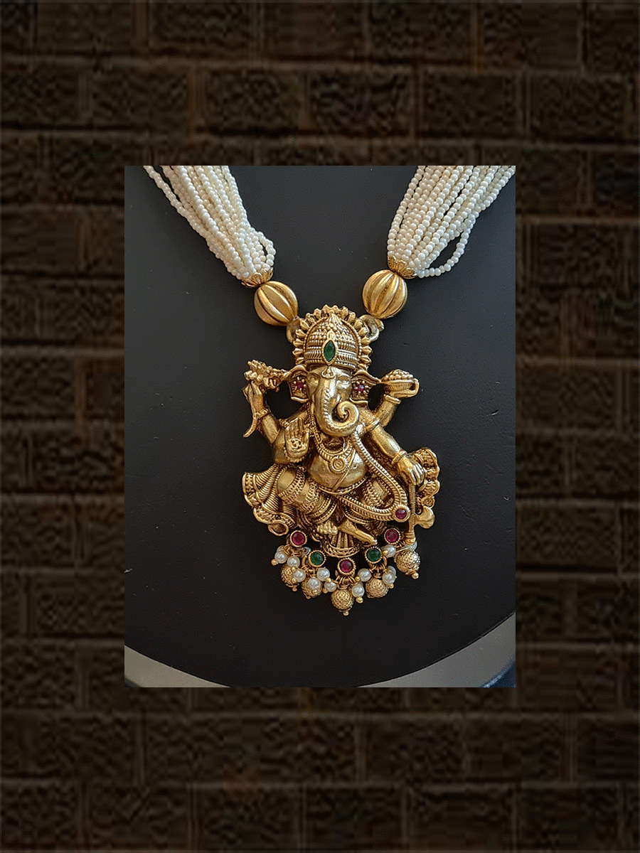 Multiple white cheed strings ganpatiji pendant set embedded with ruby and green stones with ganpatiji top jhoomki - Odara Jewellery