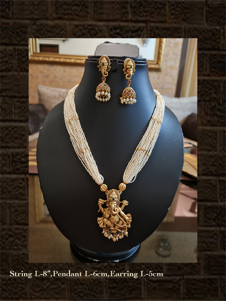 Multiple white cheed strings ganpatiji pendant set embedded with ruby and green stones with ganpatiji top jhoomki - Odara Jewellery