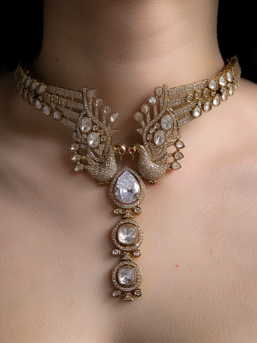 Tear shaped white stone with peacock on both sides mehendi finish moissanite set