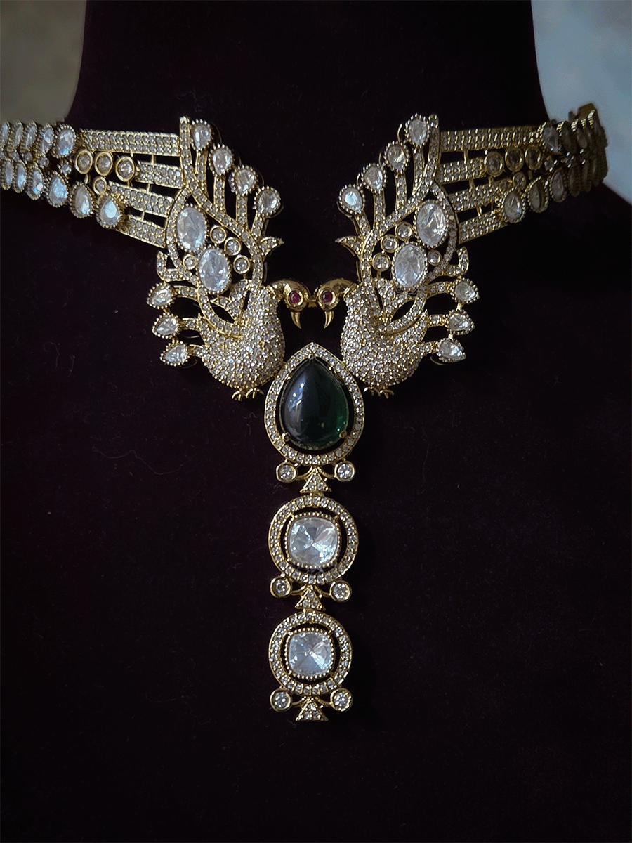 Tear shaped white stone with peacock on both sides mehendi finish moissanite set