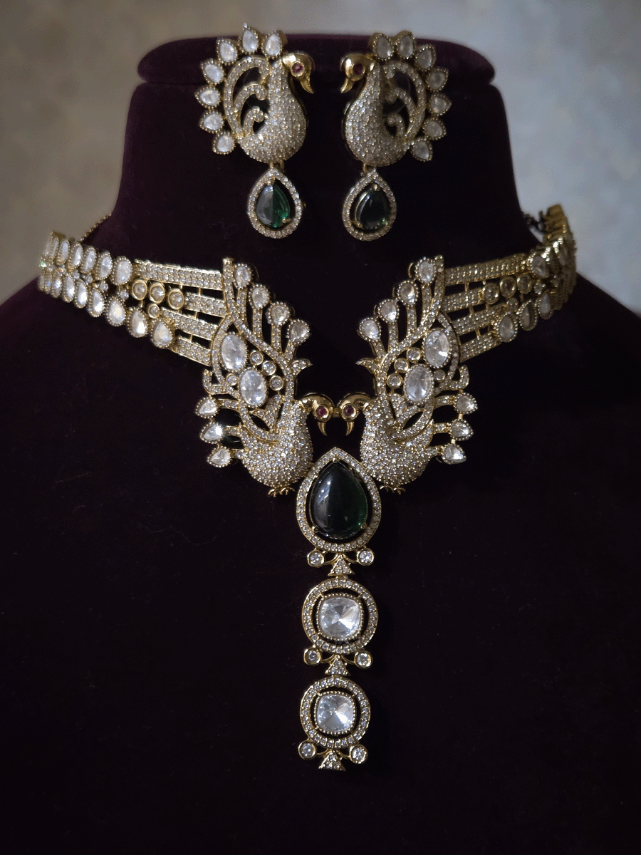 Tear shaped white stone with peacock on both sides mehendi finish moissanite set