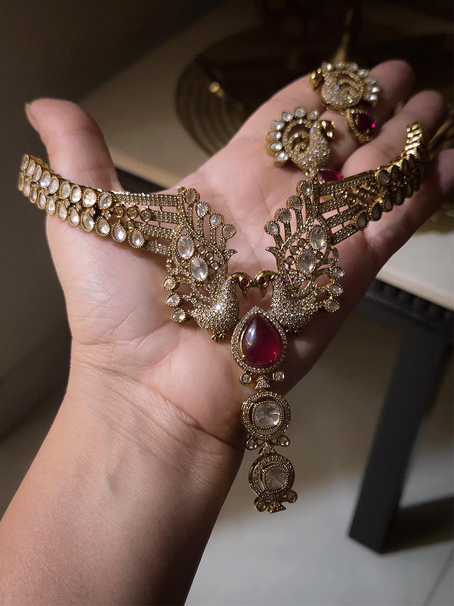 Tear shaped white stone with peacock on both sides mehendi finish moissanite set