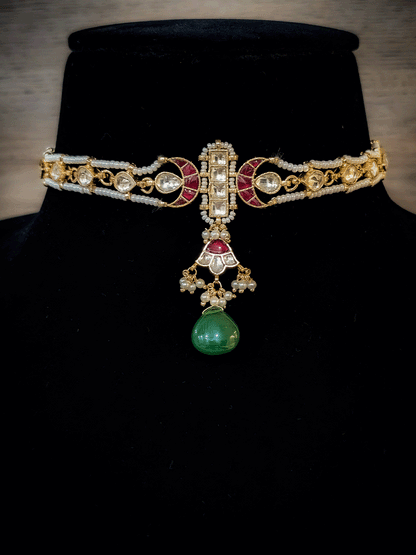 Paachi kundan long tukdi in center set with green drop and side leaf shaped kundan string