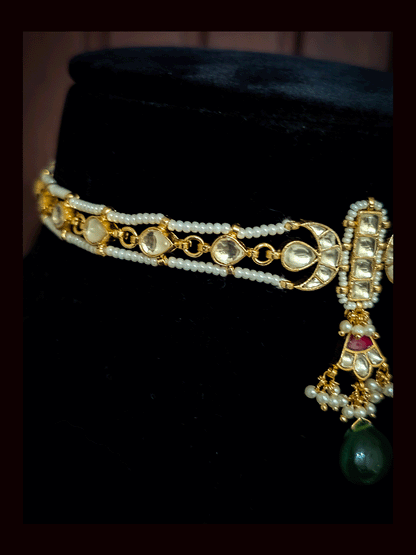 Paachi kundan long tukdi in center set with green drop and side leaf shaped kundan string