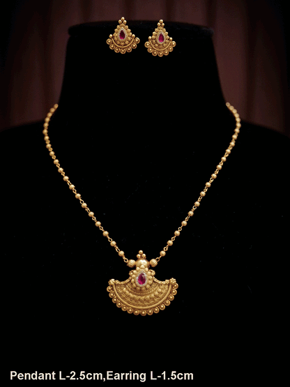 Traditional design tear drop ruby stone pendant set in gold bead chain