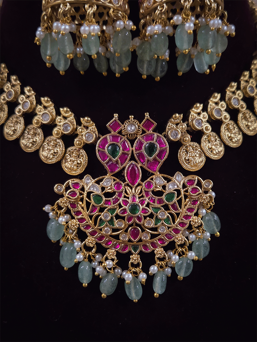 Laxmiji coin side string with ruby green paachi kundan aqua drops pendant set