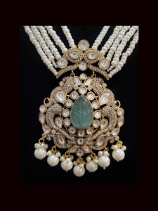 Five pearl strings kundan and AD studded set with tear drop shaped stone in the center