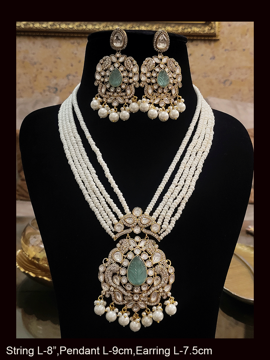 Five pearl strings kundan and AD studded set with tear drop shaped stone in the center