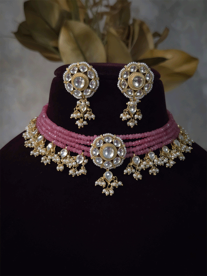 Four peach strings set with center kundan flower with pirohi and hanging kundan drops
