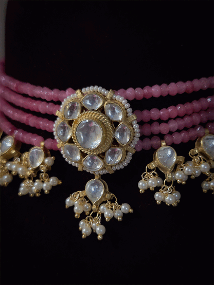 Four peach strings set with center kundan flower with pirohi and hanging kundan drops