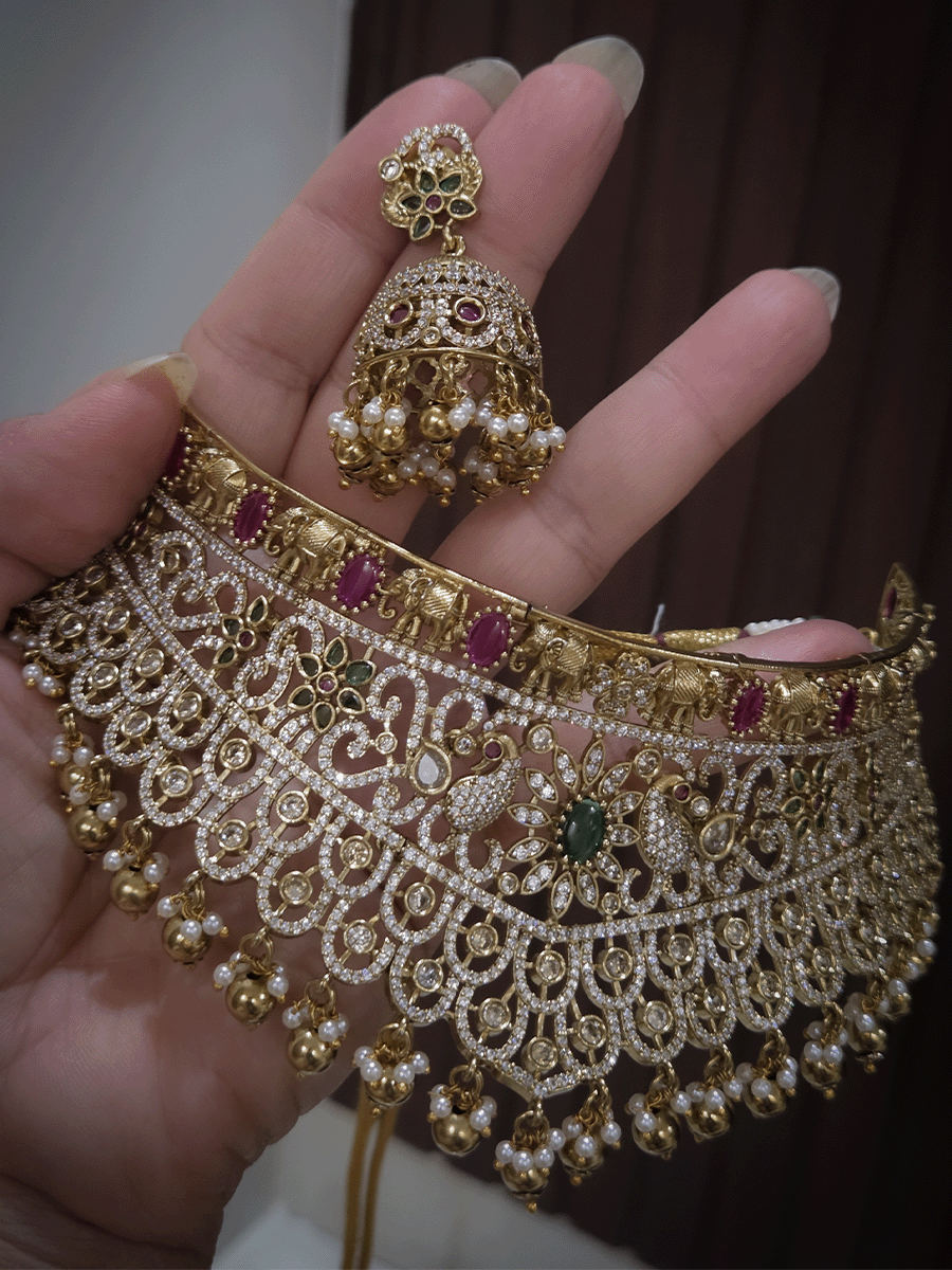 Zircon studded peacock and elephant motif's broad choker set with coloured drops