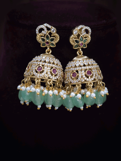 Zircon studded peacock and elephant motif's broad choker set with coloured drops