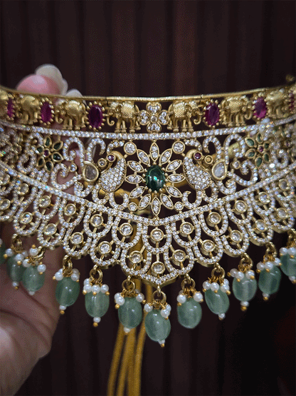 Zircon studded peacock and elephant motif's broad choker set with coloured drops