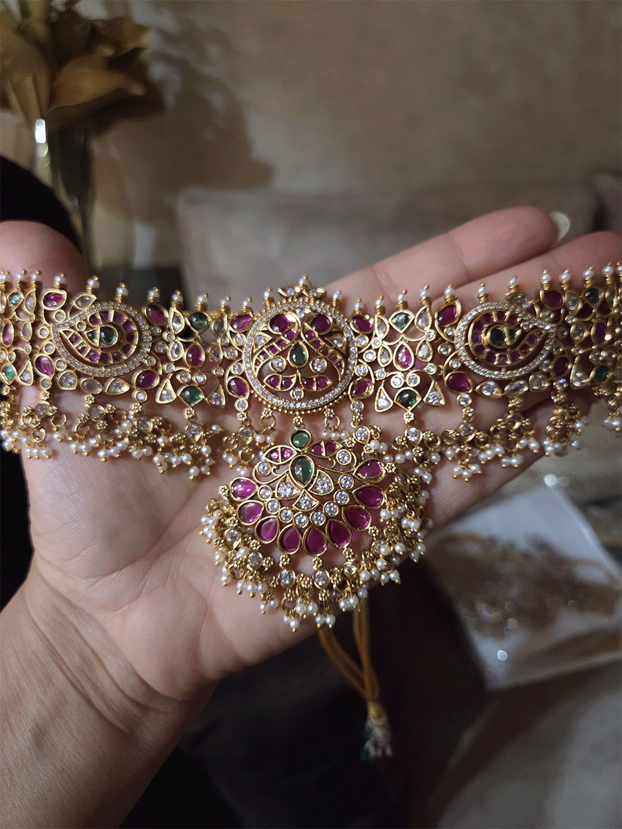 Ruby,green stones and polki studded pearly hangings choker with half ruby stones flower tukdi hanging