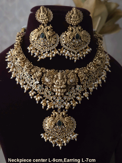 Polki and green stones studded Laxmiji center motif with peacock design set