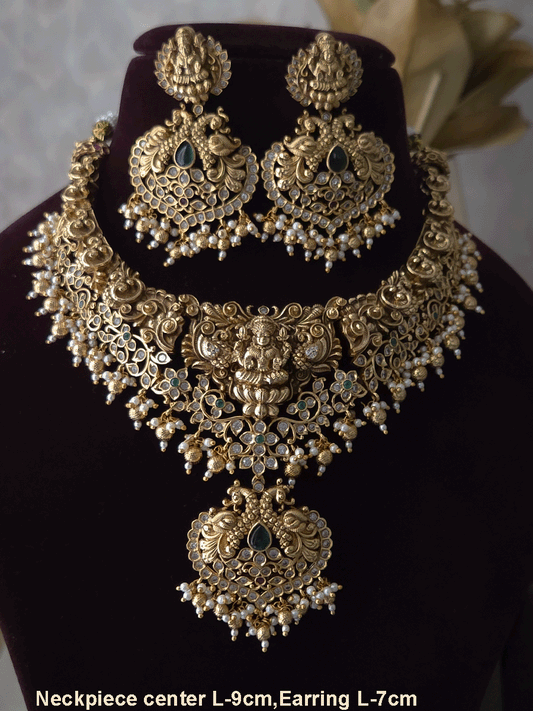 Polki and green stones studded Laxmiji center motif with peacock design set