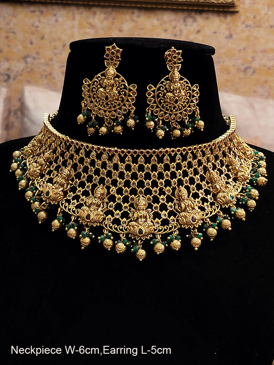 Laxmiji motif's on mesh polki design set with gold and green bead drops