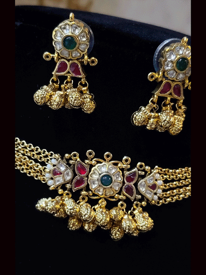 Paachi kundan ruby and green stone center with ghunghru hangings set with four chains string