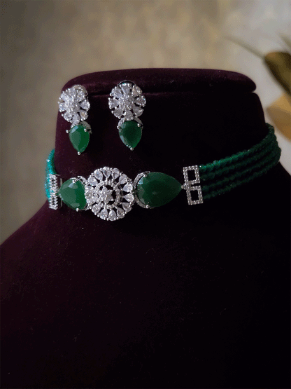 Circular center AD flower with side tear shaped stone and four onyx bead strings set