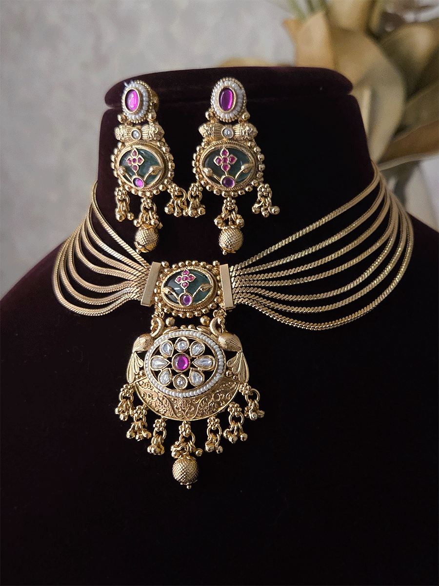 Seven layer gold chain set with kundan flower center pendant and aqua stone with inlay work on top