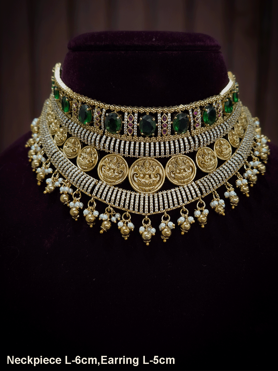 Zircon studded laxmiji motif's broad choker set with oval green stones