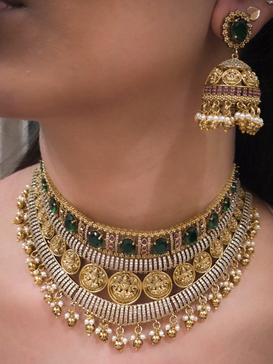 Zircon studded laxmiji motif's broad choker set with oval green stones