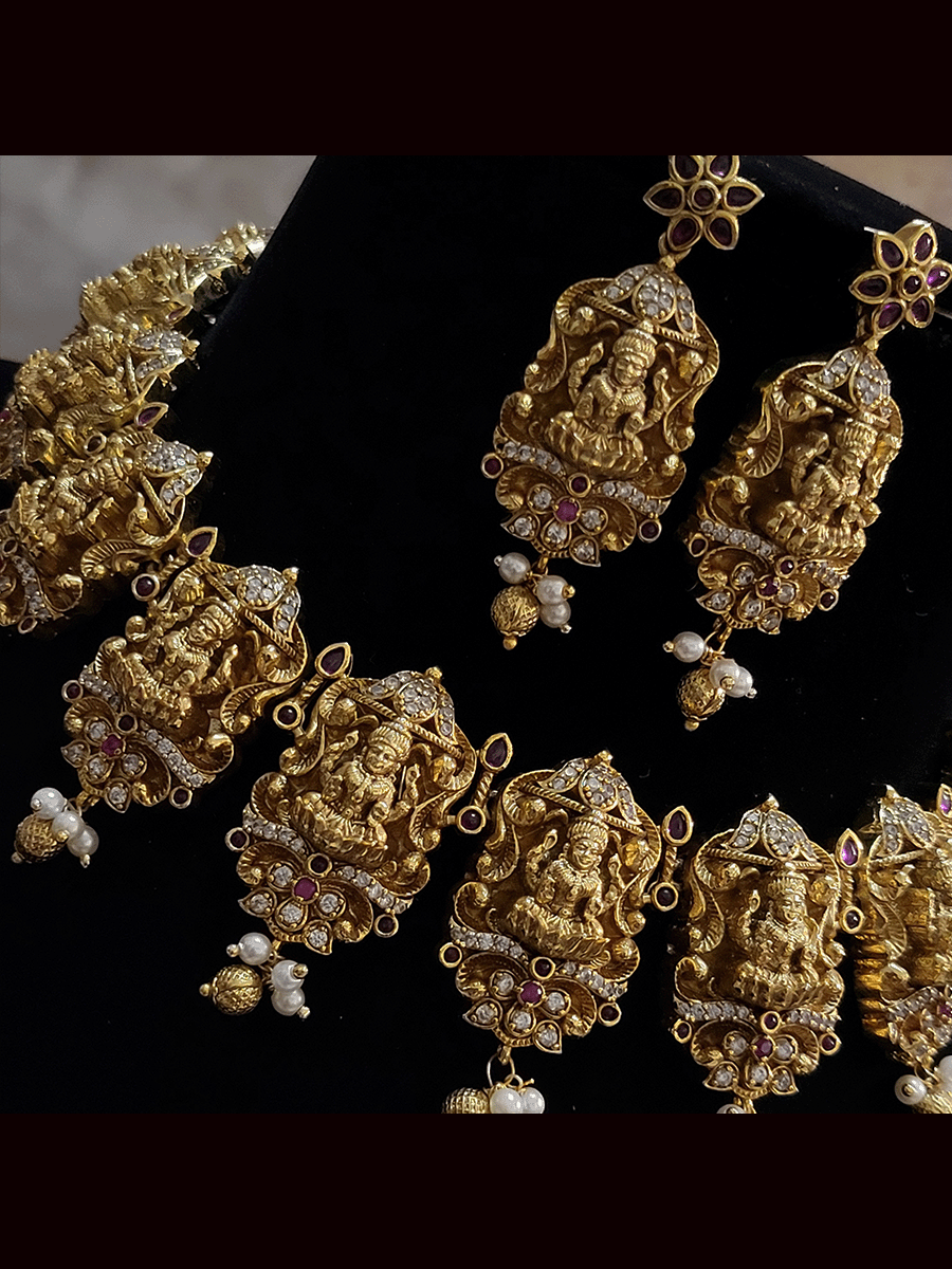 Laxmiji tukdies studded with ruby stones and zircons and pearly hangings set