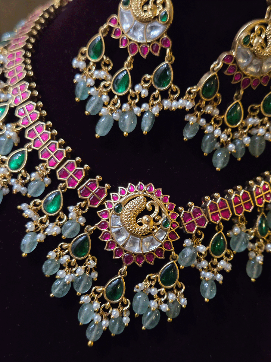 Peacock design center with green tear drop hangings and aqua bead drops paachi kundan set