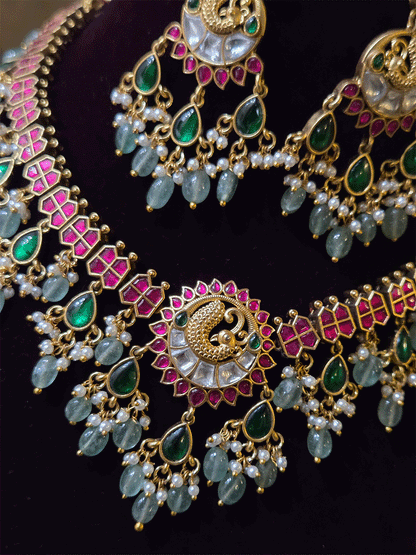 Peacock design center with green tear drop hangings and aqua bead drops paachi kundan set