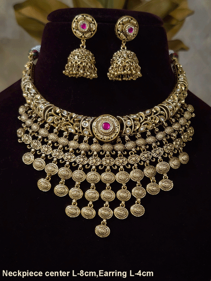 Intricately carved kundan studded hasli set with ruby stone in center and oval design tassels